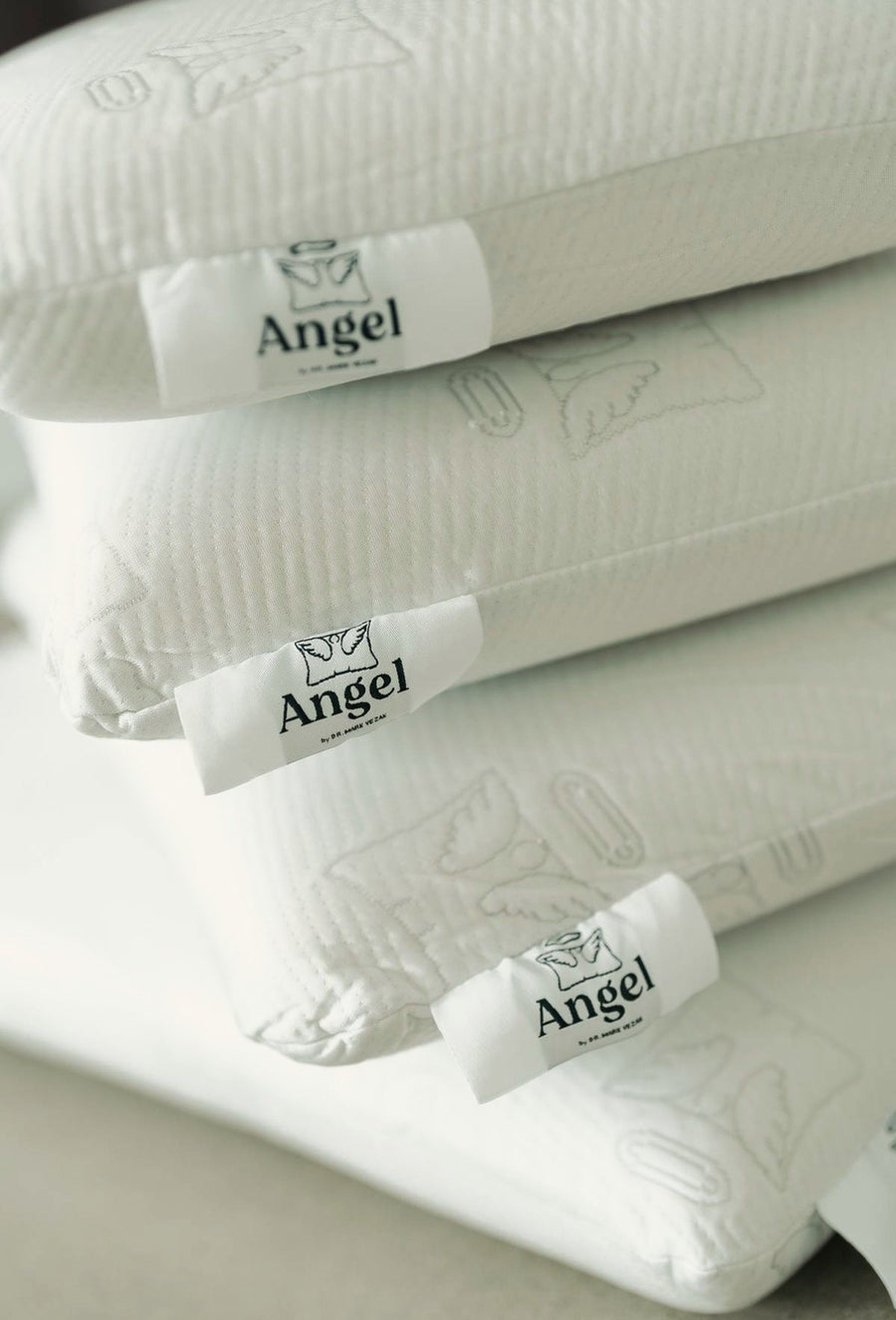 The Angel Pillow &mdash; a stack of chiropractor-designed cervical support pillows