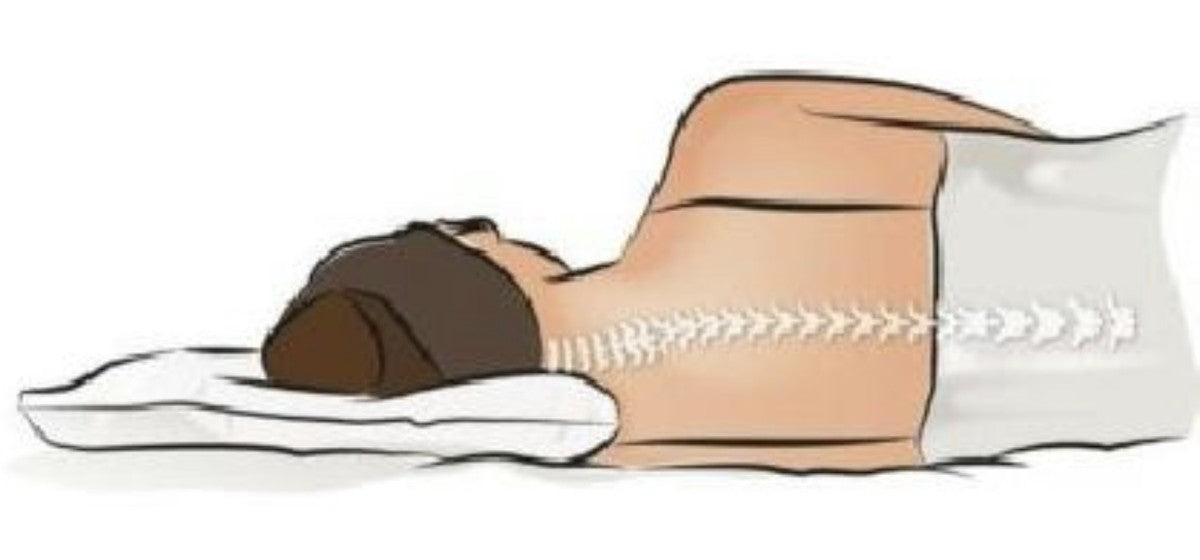 Side sleeper on a low ordinary pillow: the head drops and the spine bends downward at the neck