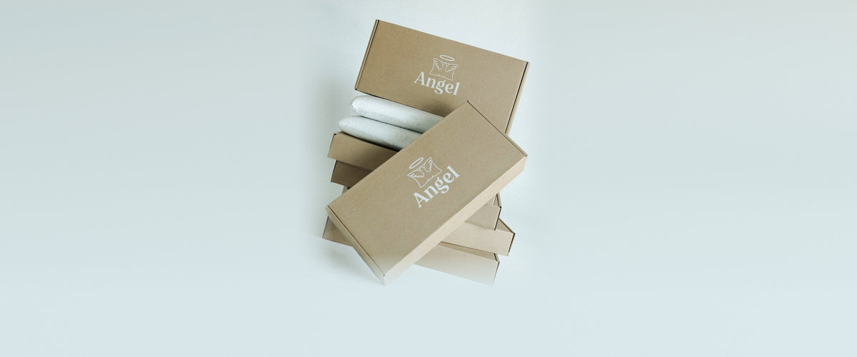 Angel Pillow kraft boxes stacked with two pillows